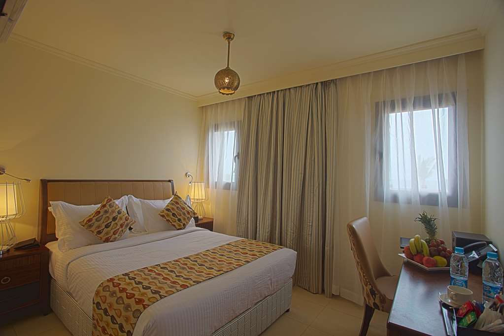 Golden Tulip Sharma Resort Room photo